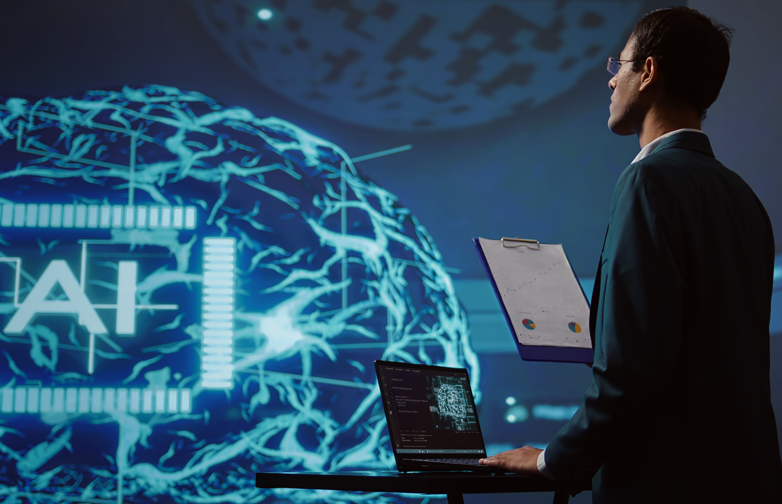 startup employee looking over business charts, using ai software